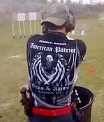 Man at a shooting range, wearing an