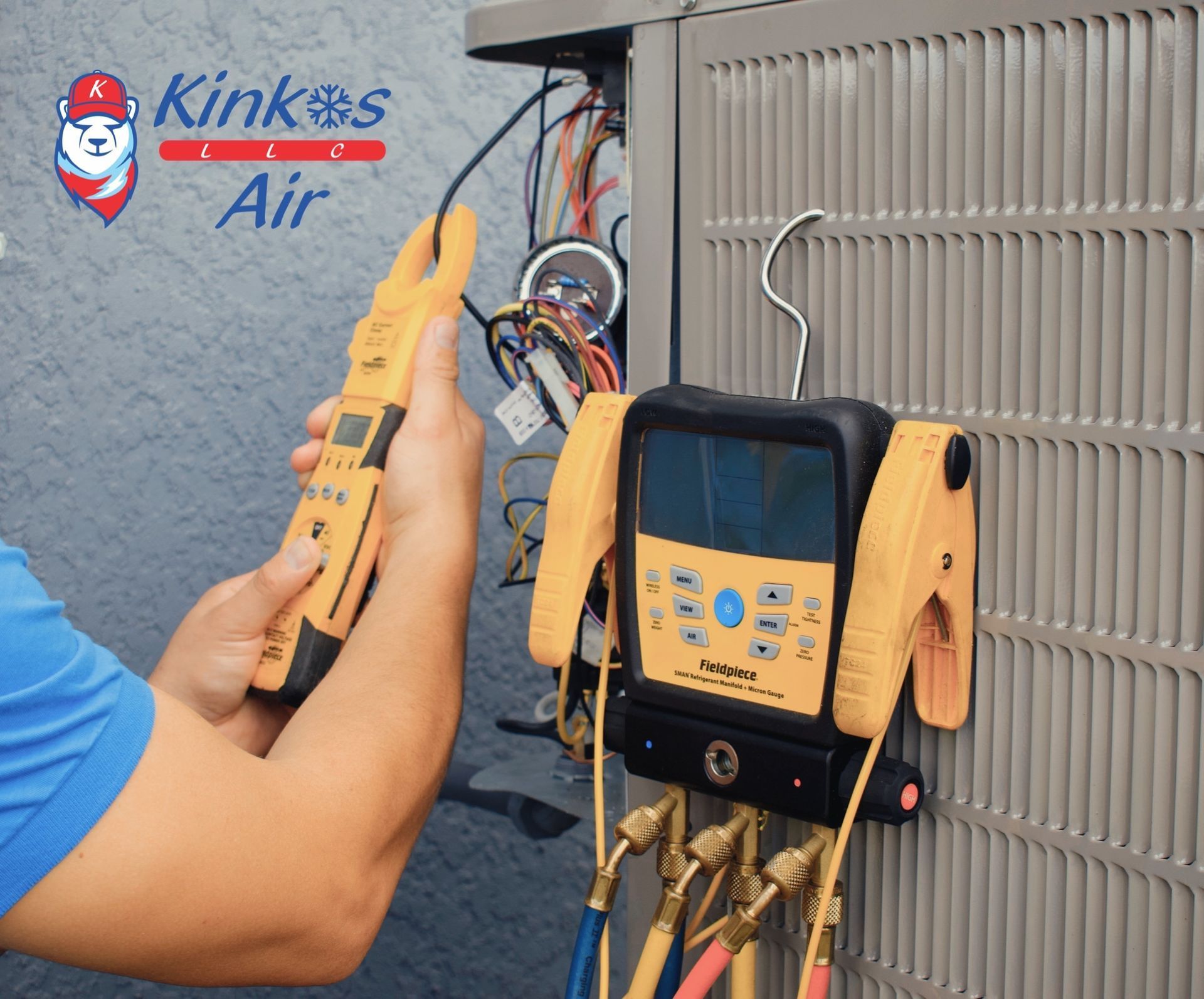 Technician using yellow gauge on HVAC unit beside outdoor condenser and service tools