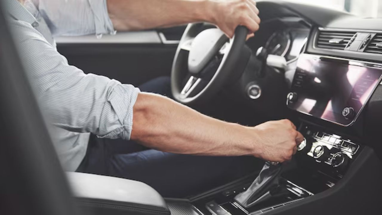 Driver shifting gears while driving.