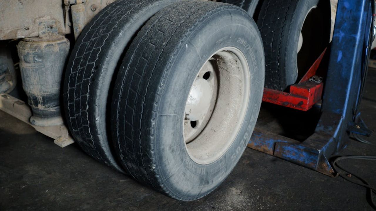 Commercial truck tires displaying severe uneven wear and tread deterioration