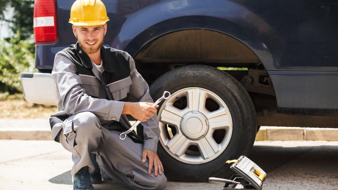 Taking professional help to fix the spare tire