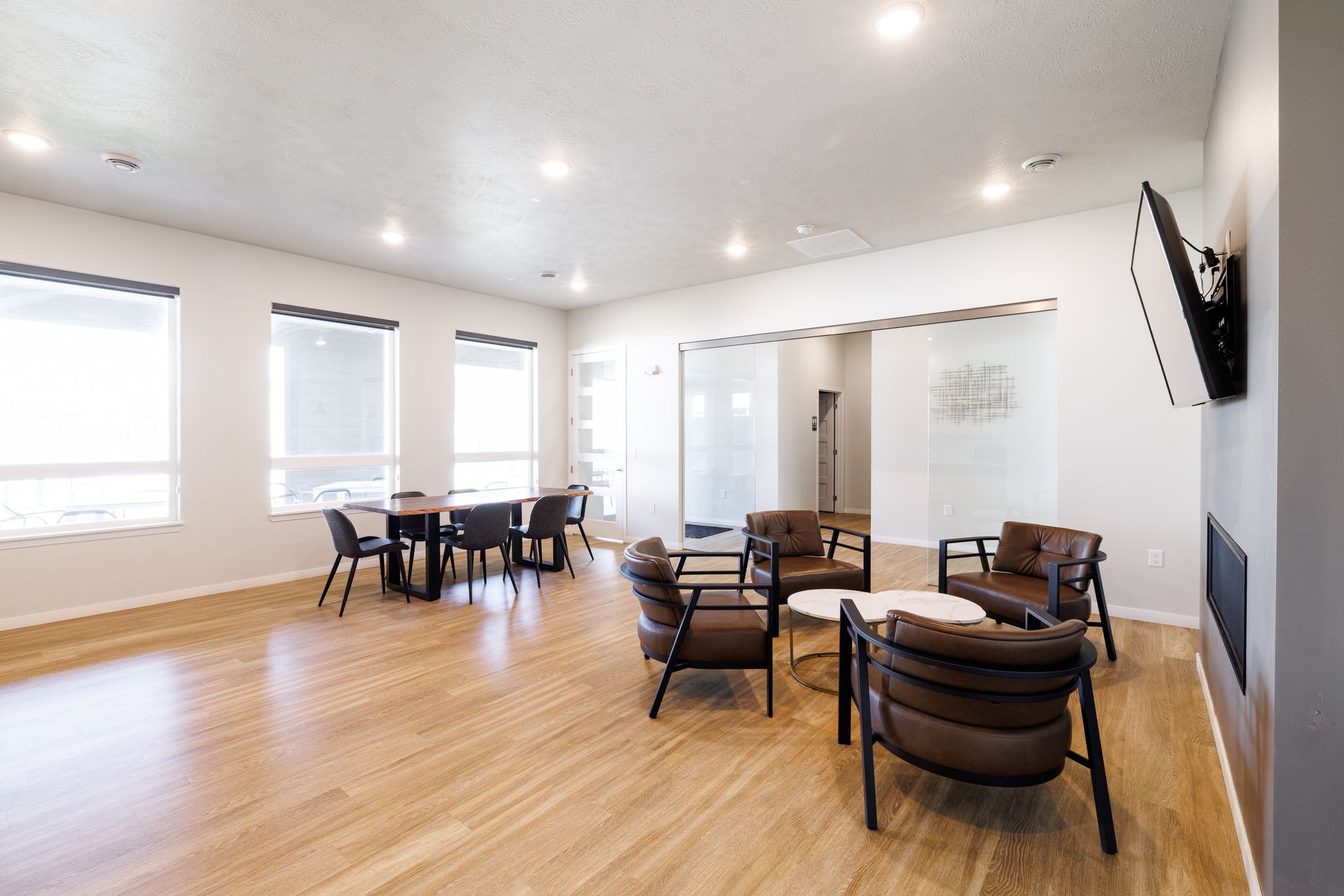 Inside clubhouse with tables and chairs
