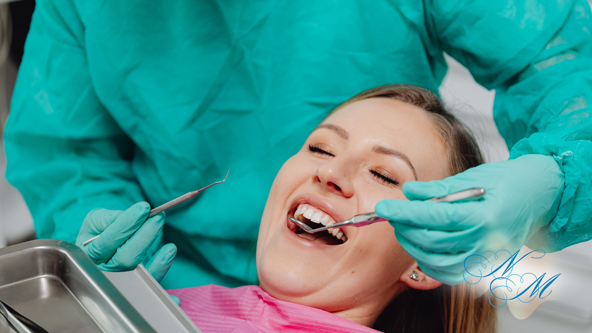 Woman in dental chair, mouth open, dentist examining teeth with tools.