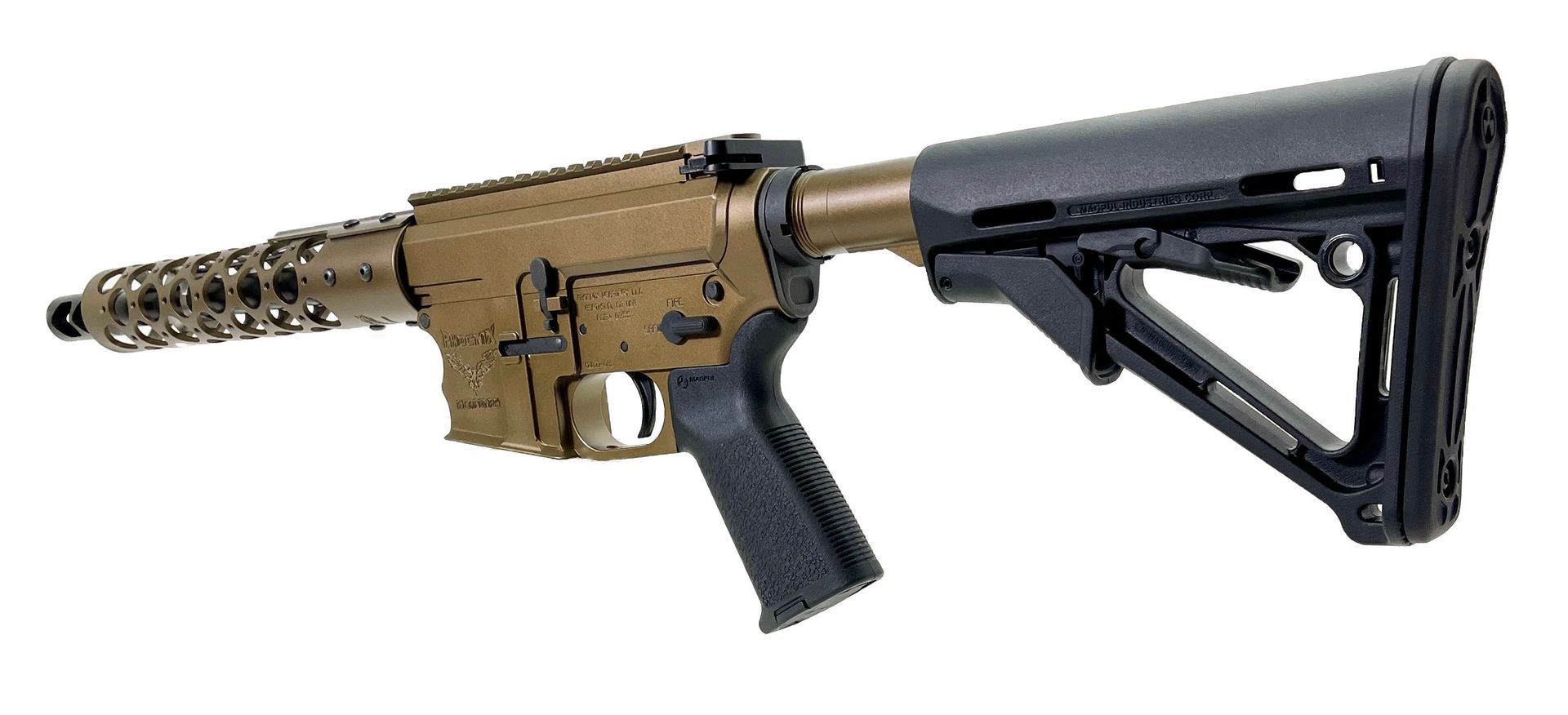 Tan and black rifle on a white background. It has a spiral barrel and adjustable stock.