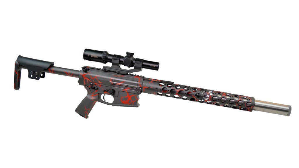 Black and red rifle with a scope, against a white background.