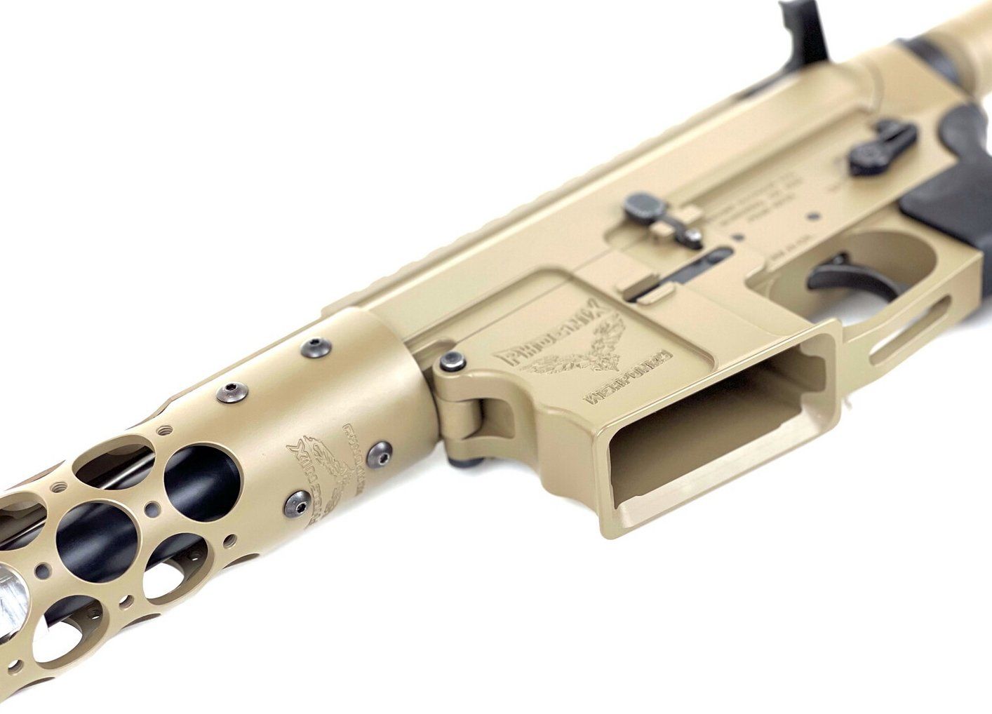 Tan colored rifle, close-up. Features a vented handguard, receiver with markings, and black accents.