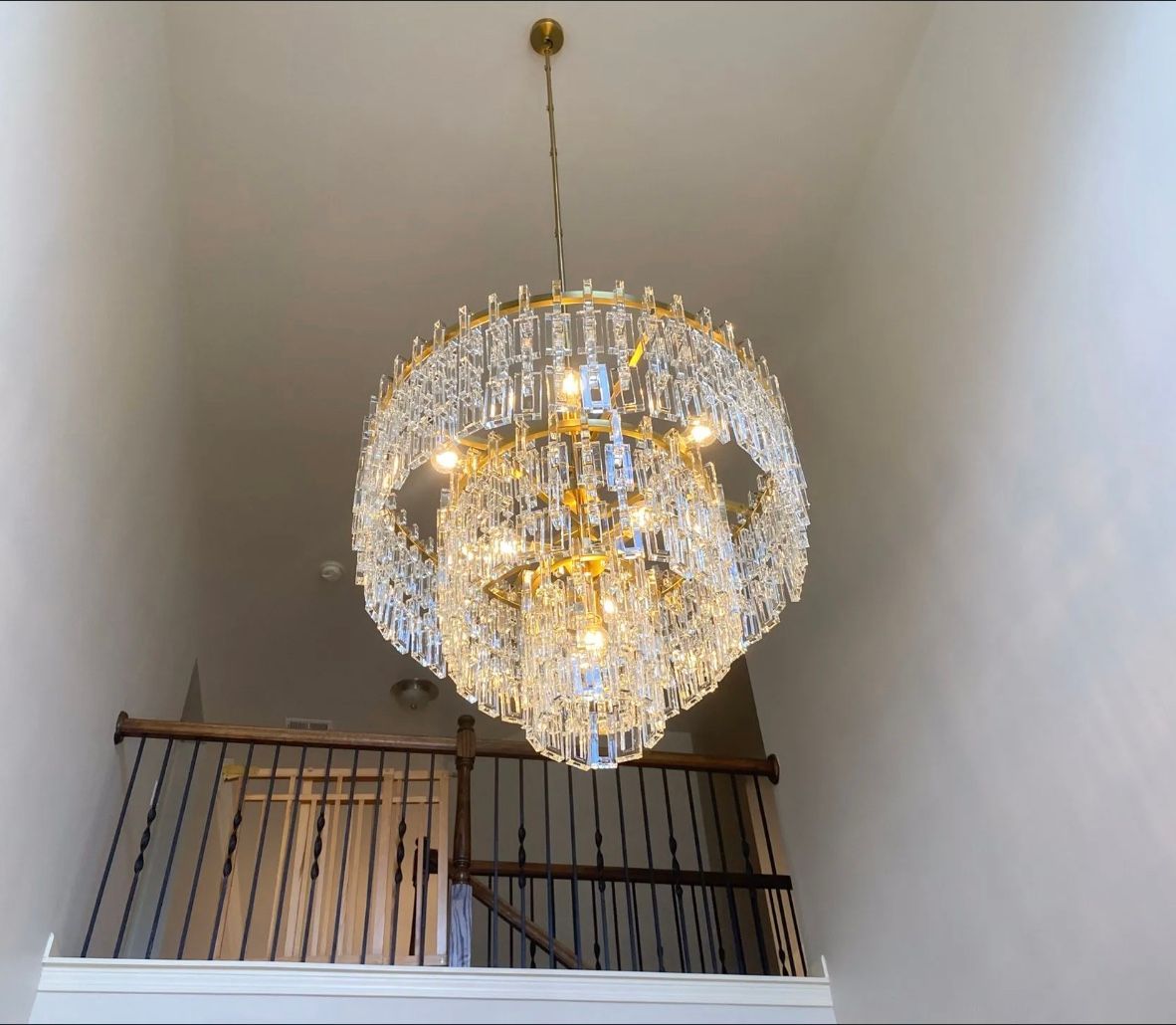 A chandelier light installation in Gainesville GA by Professional Systems Design
