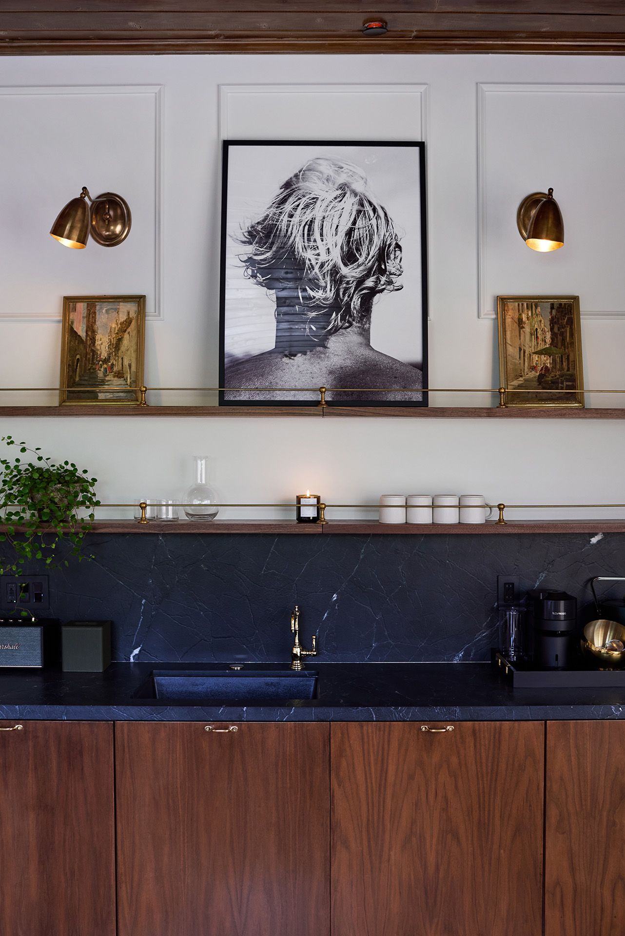 Cozy living room with wood ceiling, leather chairs, and built-in shelves around a dark console tv.