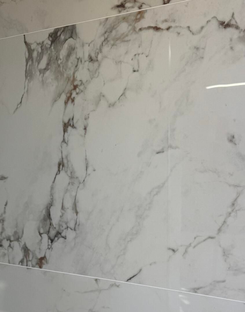 Diphda Gold Polished Porcelain Tile in 1200x600 available in County Durham