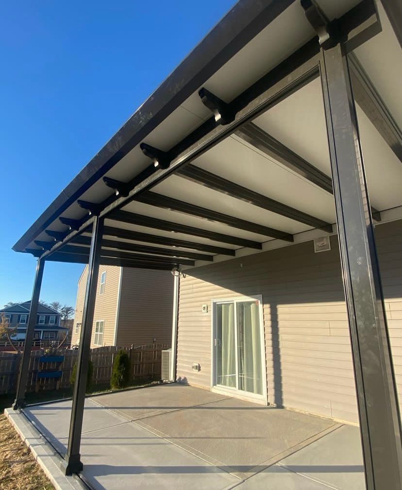 A house with a covered patio and a sliding glass door