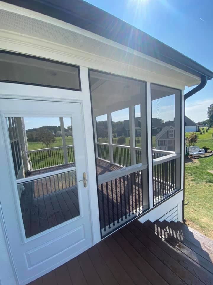 A screened in porch with stairs leading up to it