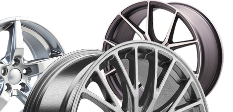 Three shiny alloy car rims in silver, gray, and dark metallic finishes