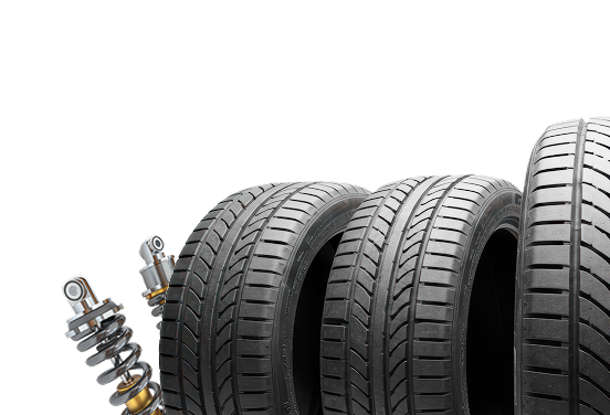 Three car tires with shock absorbers on a white background