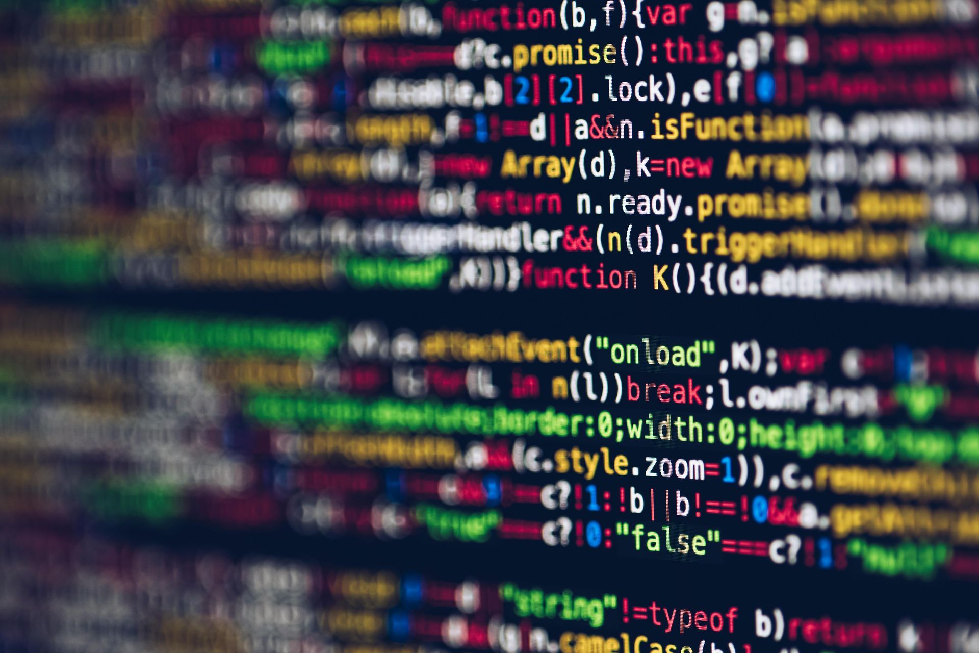 Lines of colorful computer code on a dark background.