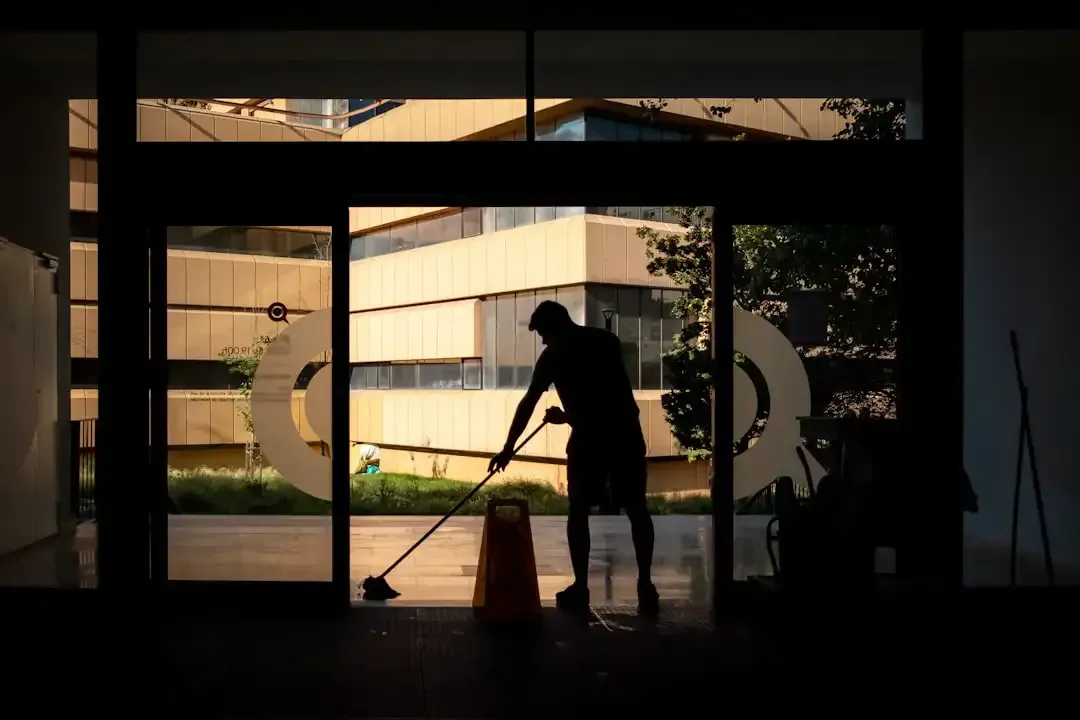 A professional cleaning team working efficiently in a commercial office