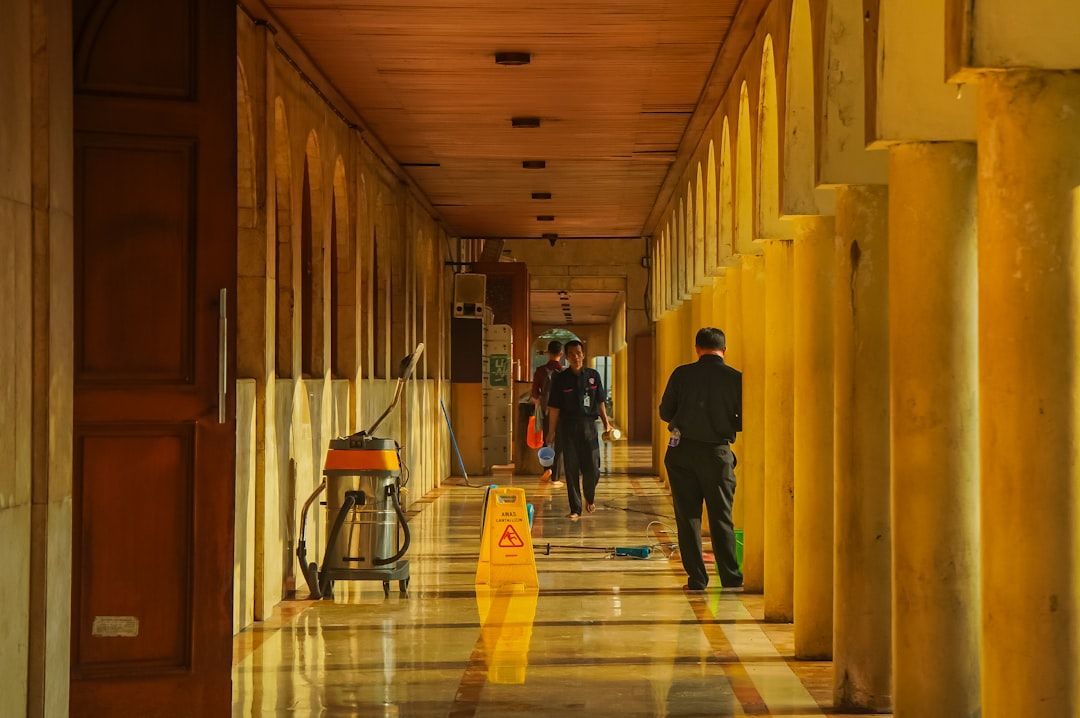 Professional floor buffing and maintenance in a commercial lobby