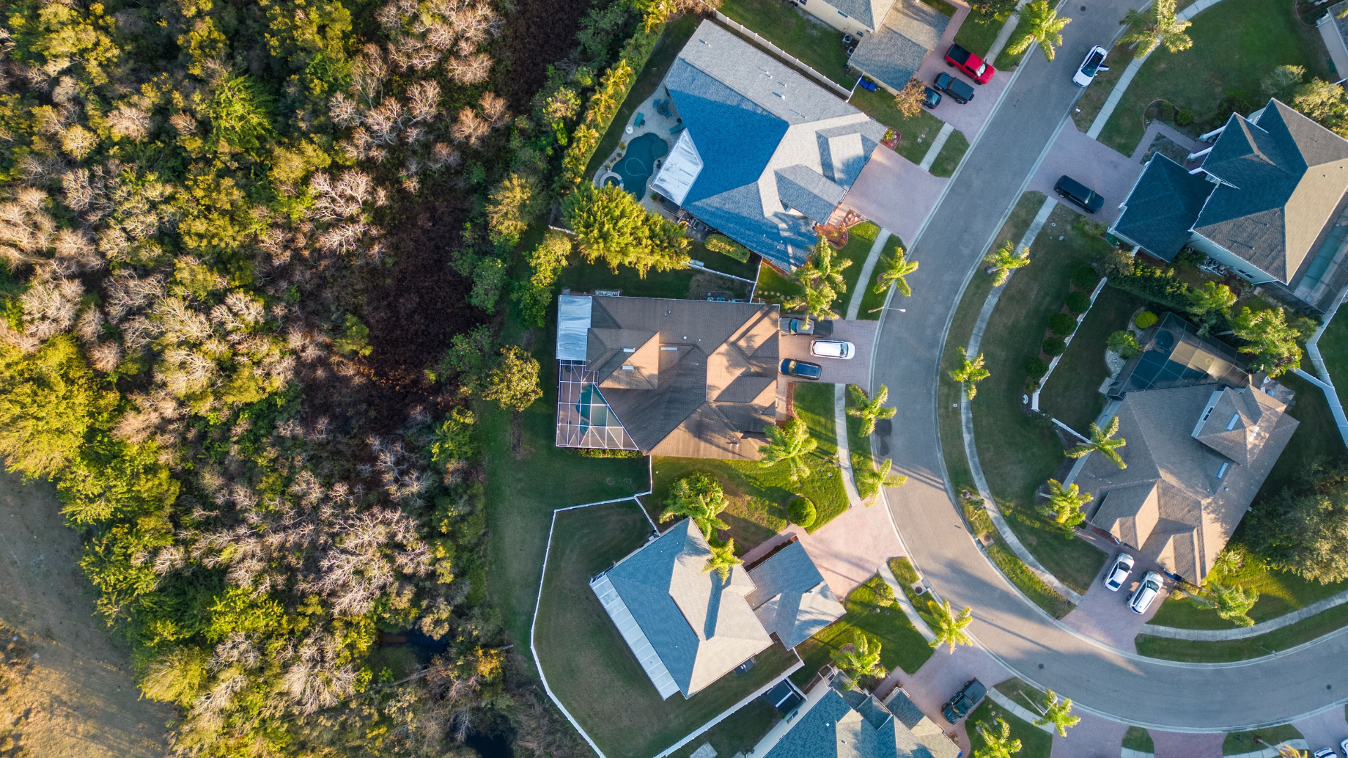 A large house with a large swimming pool in the backyard