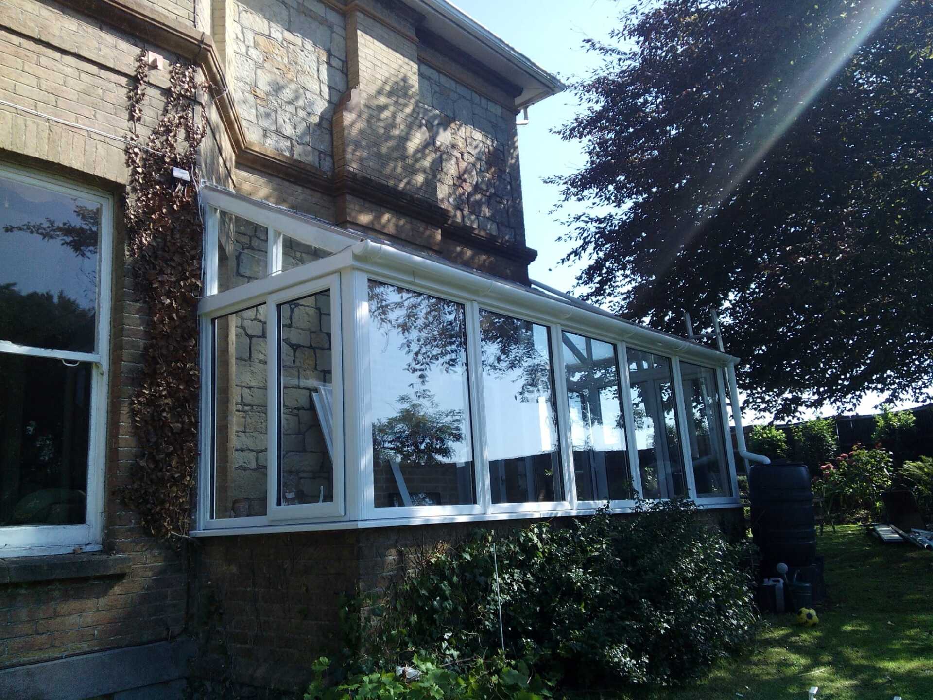 A house with a conservatory on the side of it
