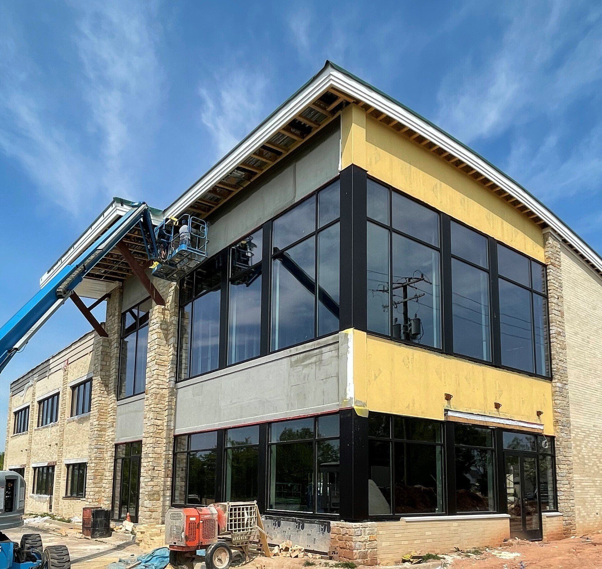 A large building with a lot of windows under construction