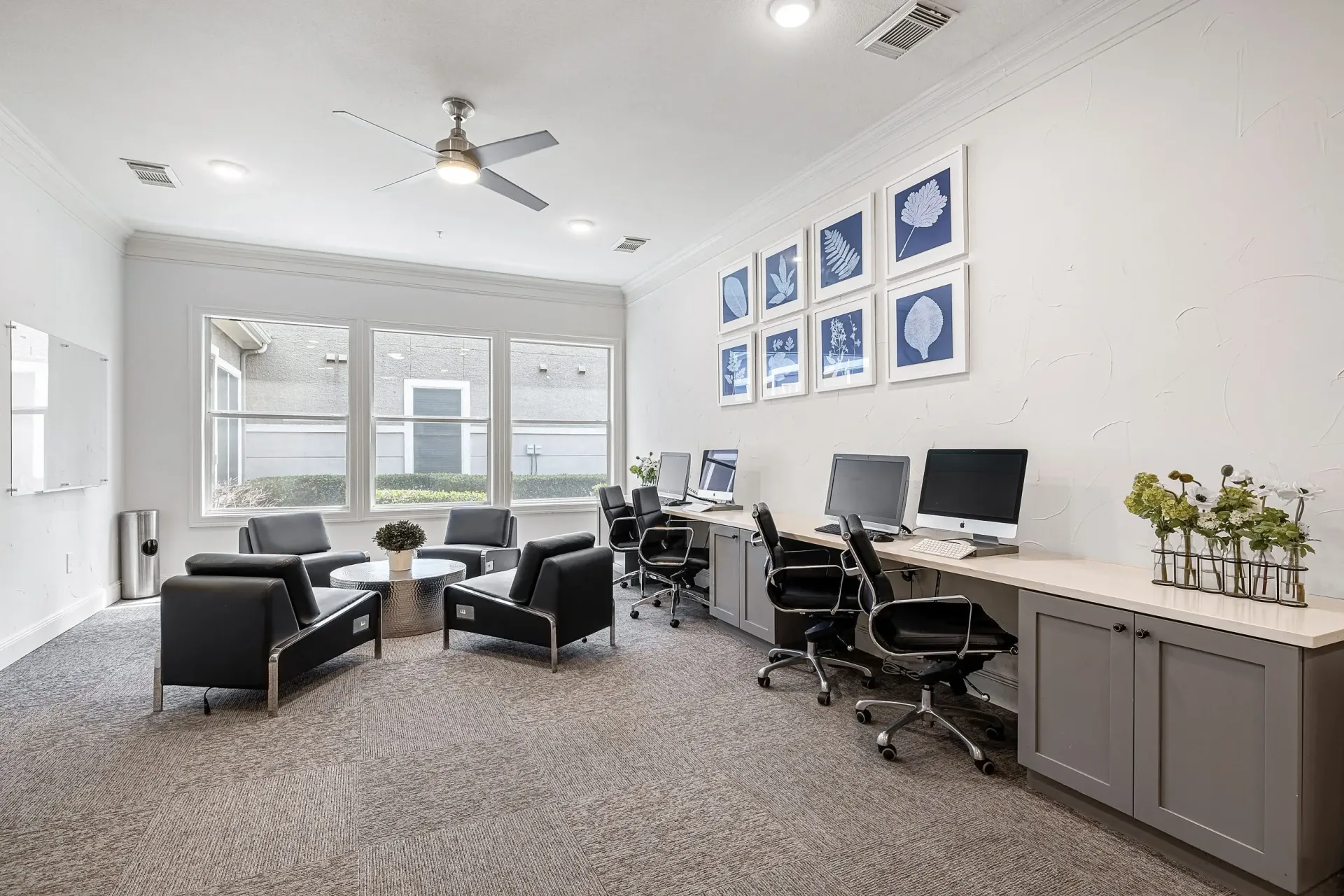 Business center with computers and seating area