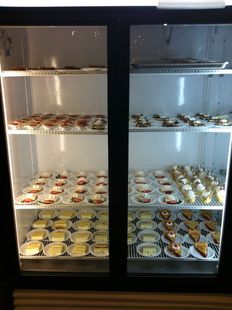A refrigerator filled with a variety of desserts