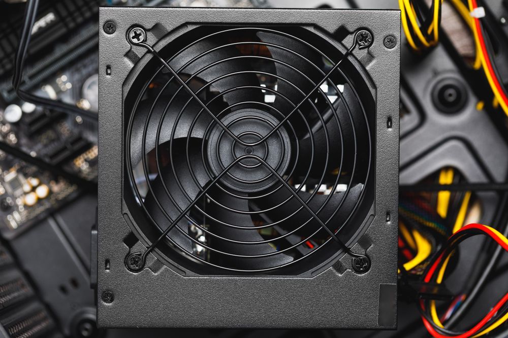 A Close Up of a Power Supply Fan on Top of a Computer Motherboard — Computers NQ in Aitkenvale, QLD