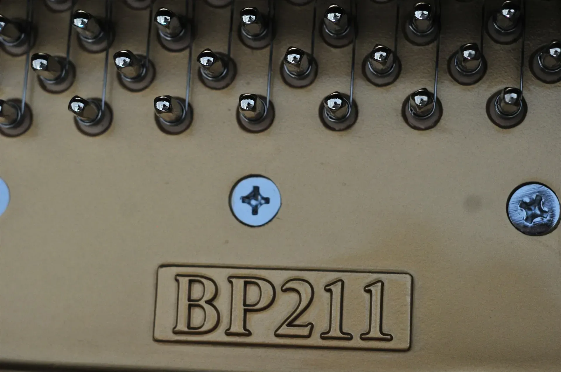 A piano with the number bp211 on it