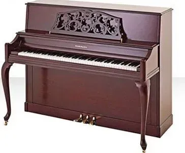 A brown upright piano is sitting on a white surface.
