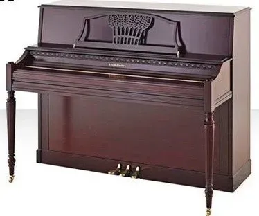 A piano with a crown on the top of it