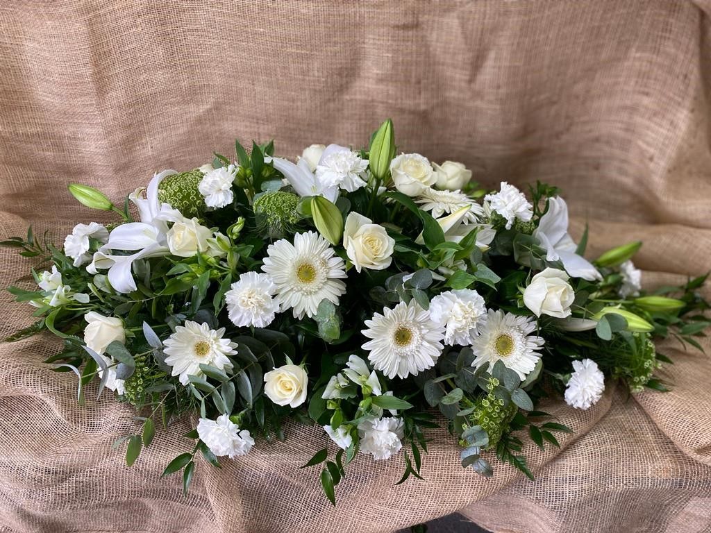 Click to view pictures & prices White seasonal coffin spray