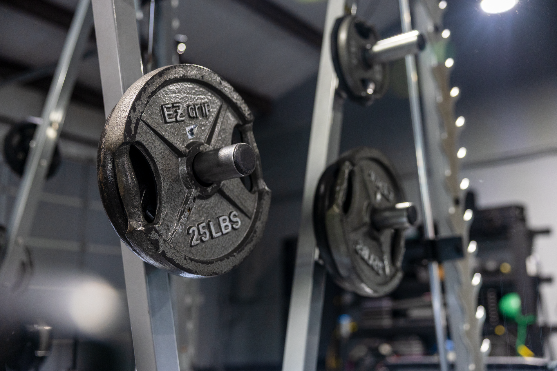 Black weights on silver gym equipment at 360 image fitness gym in watkinsville, ga