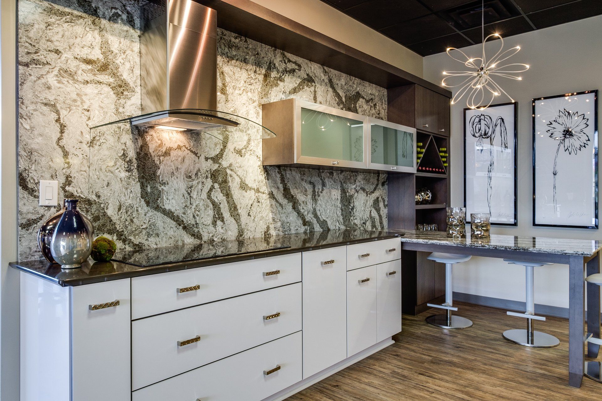 Modern kitchen with white cabinets, granite countertops, copper range hood, and a glass desk area