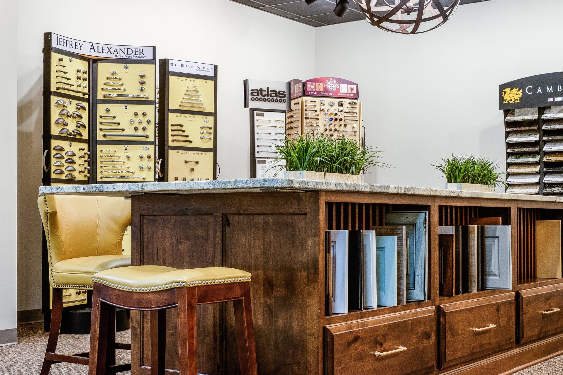 Rustic café counter with menu boards, wooden stools, and potted plants in a bright interior.