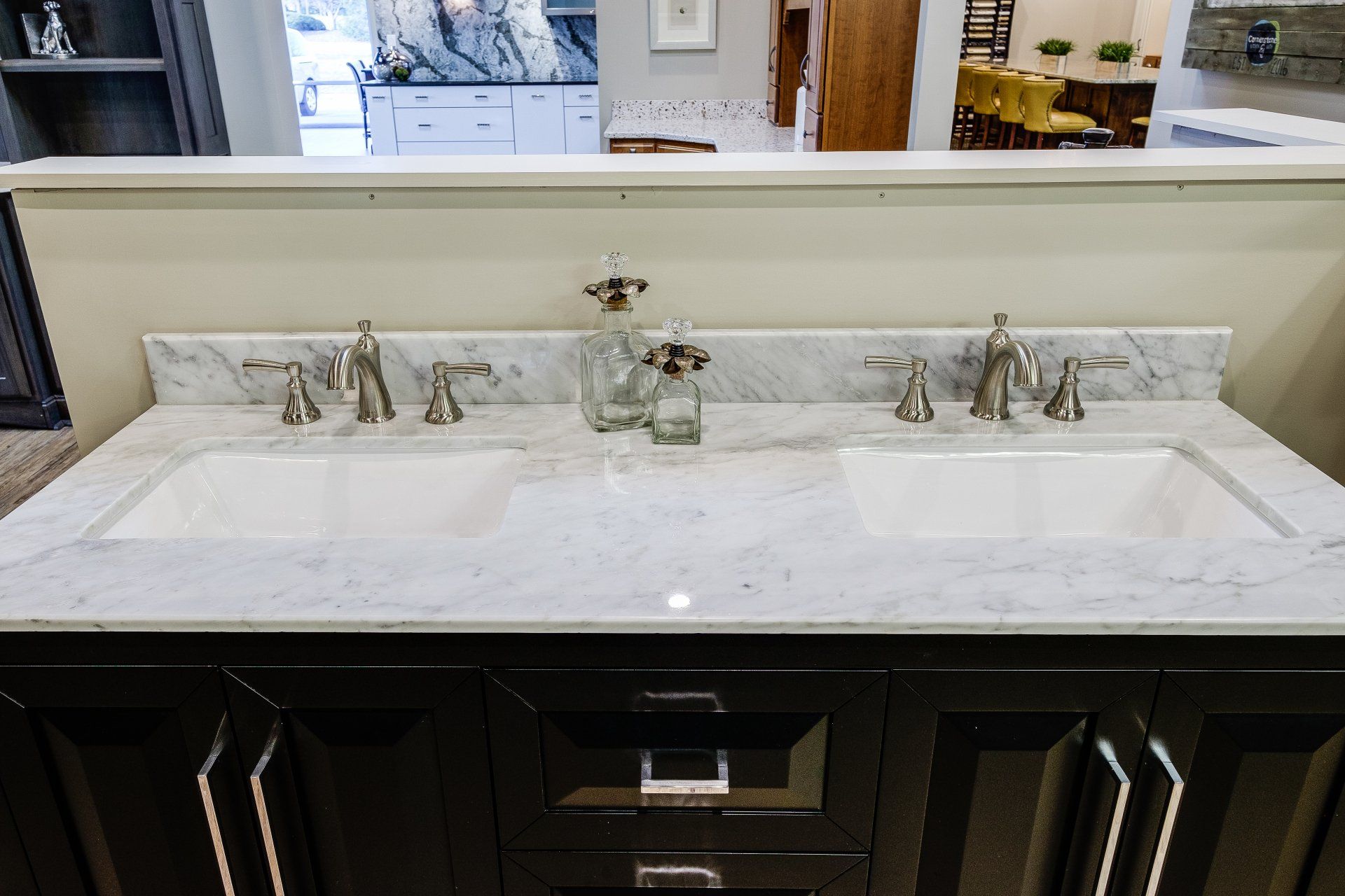 Double-sink bathroom vanity with white marble countertop and dark wood cabinets