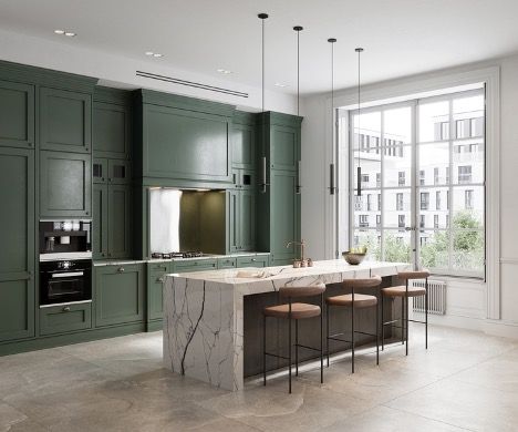 Modern kitchen with dark green cabinets, marble island, and large window overlooking city buildings