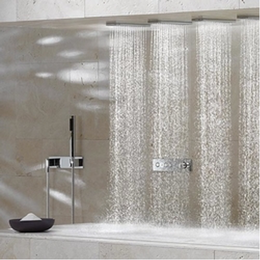 Modern bathroom with glass shower wall, rain showerhead, and black bowl on the counter