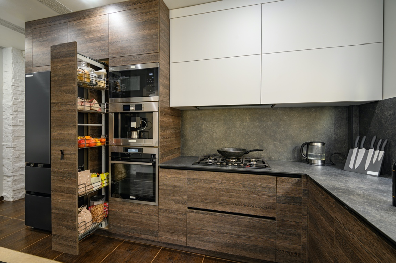 Modern kitchen with open pantry, wood cabinets, white upper cabinets, and countertop appliances