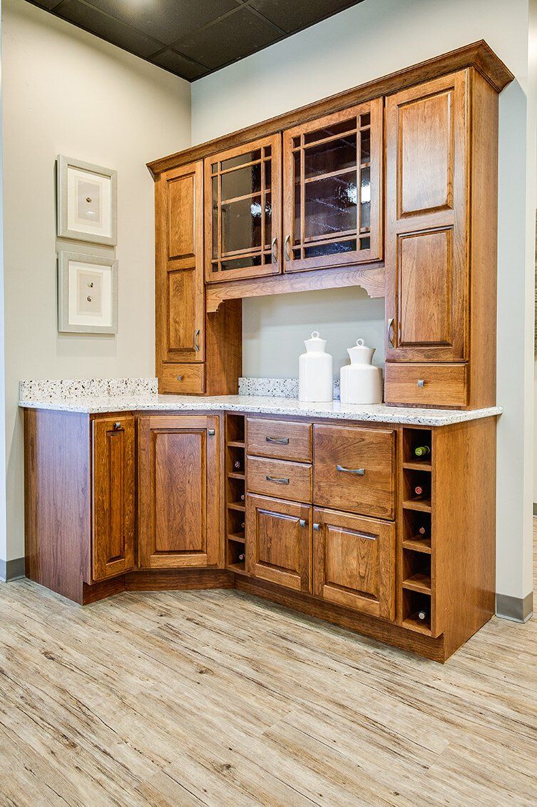 Wooden built-in cabinet with marble countertop in a light beige room