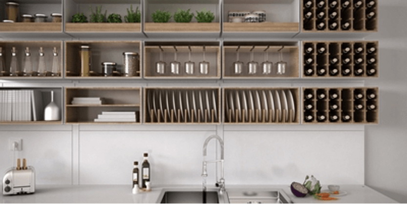 Modern white kitchen with open wooden shelves, dishes, jars, and small appliances on a clean countertop