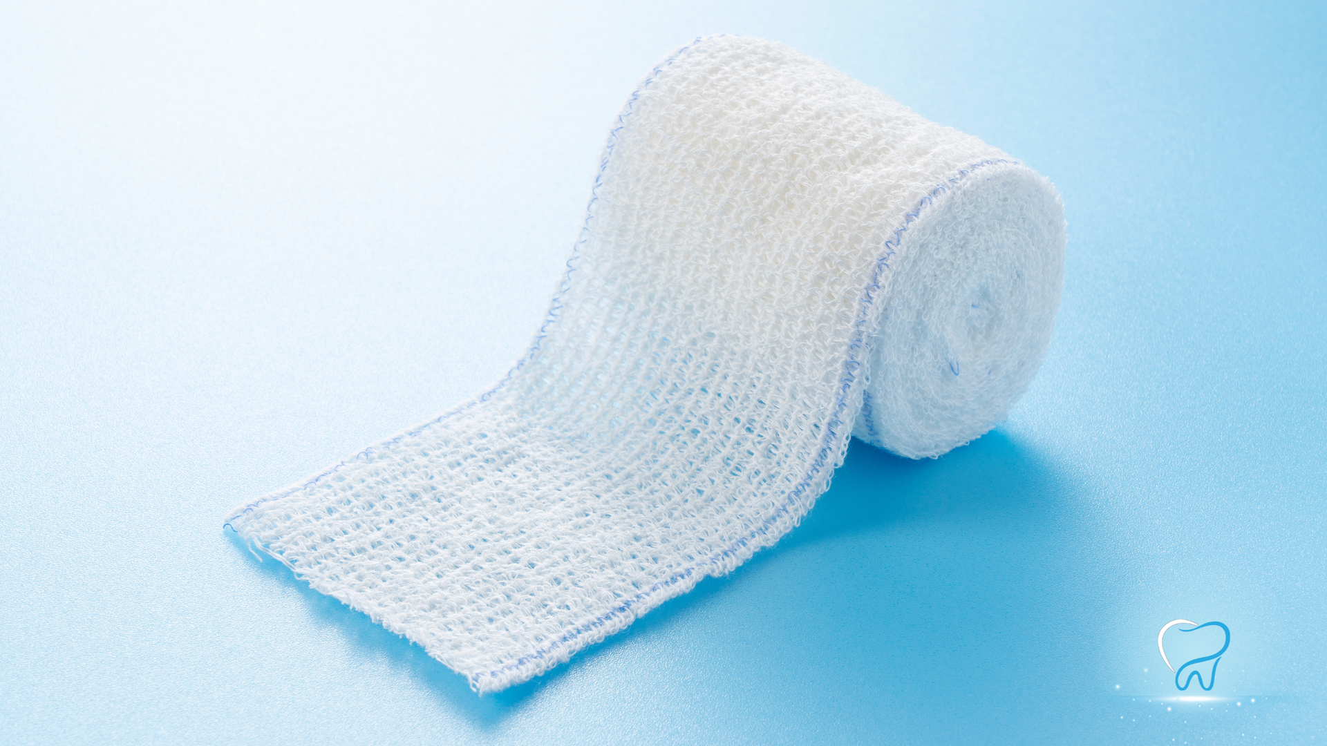 White rolled bandage on a light blue background