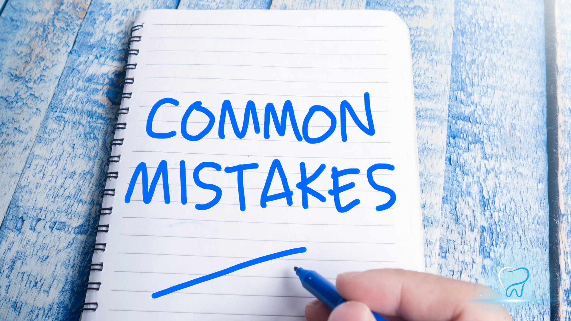 Notebook page reading “COMMON MISTAKES” in blue ink, with a hand underlining it