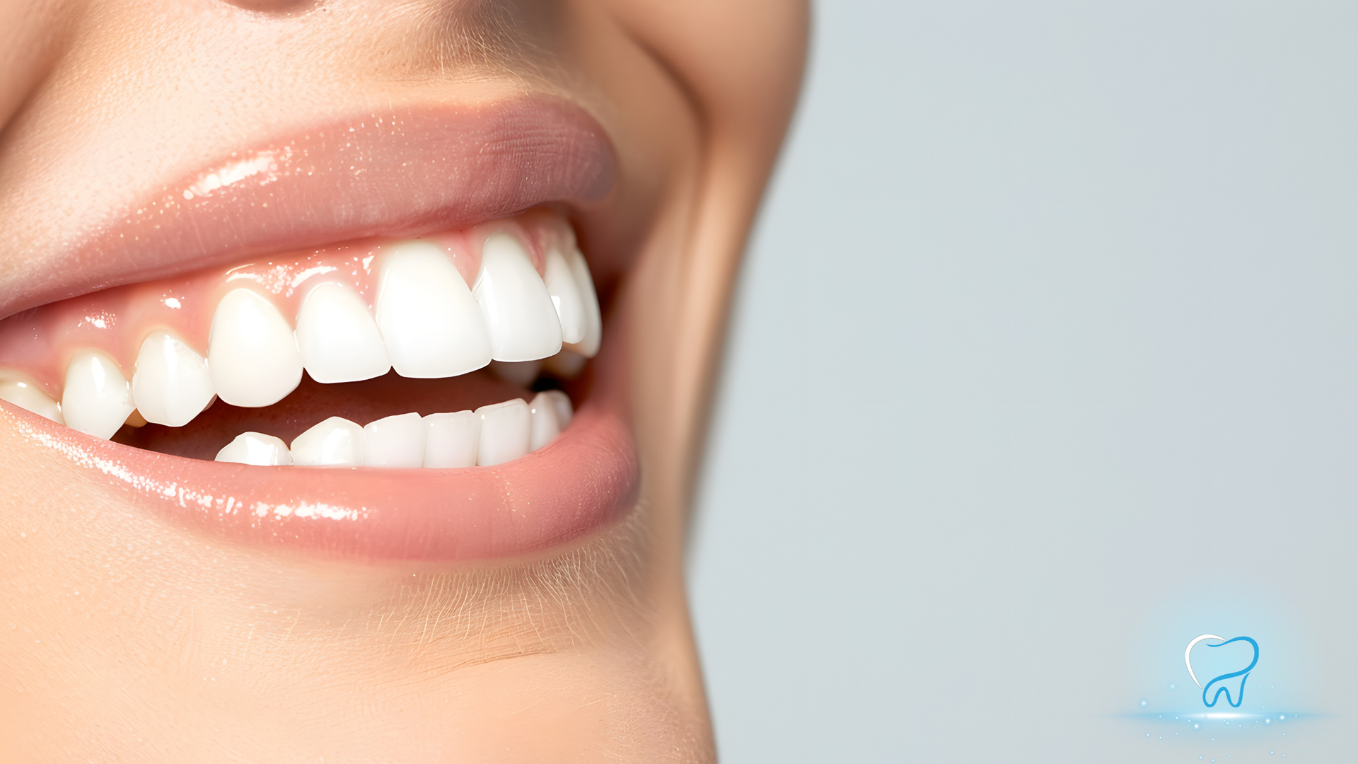 Close-up of a smiling mouth with white teeth and pink lips