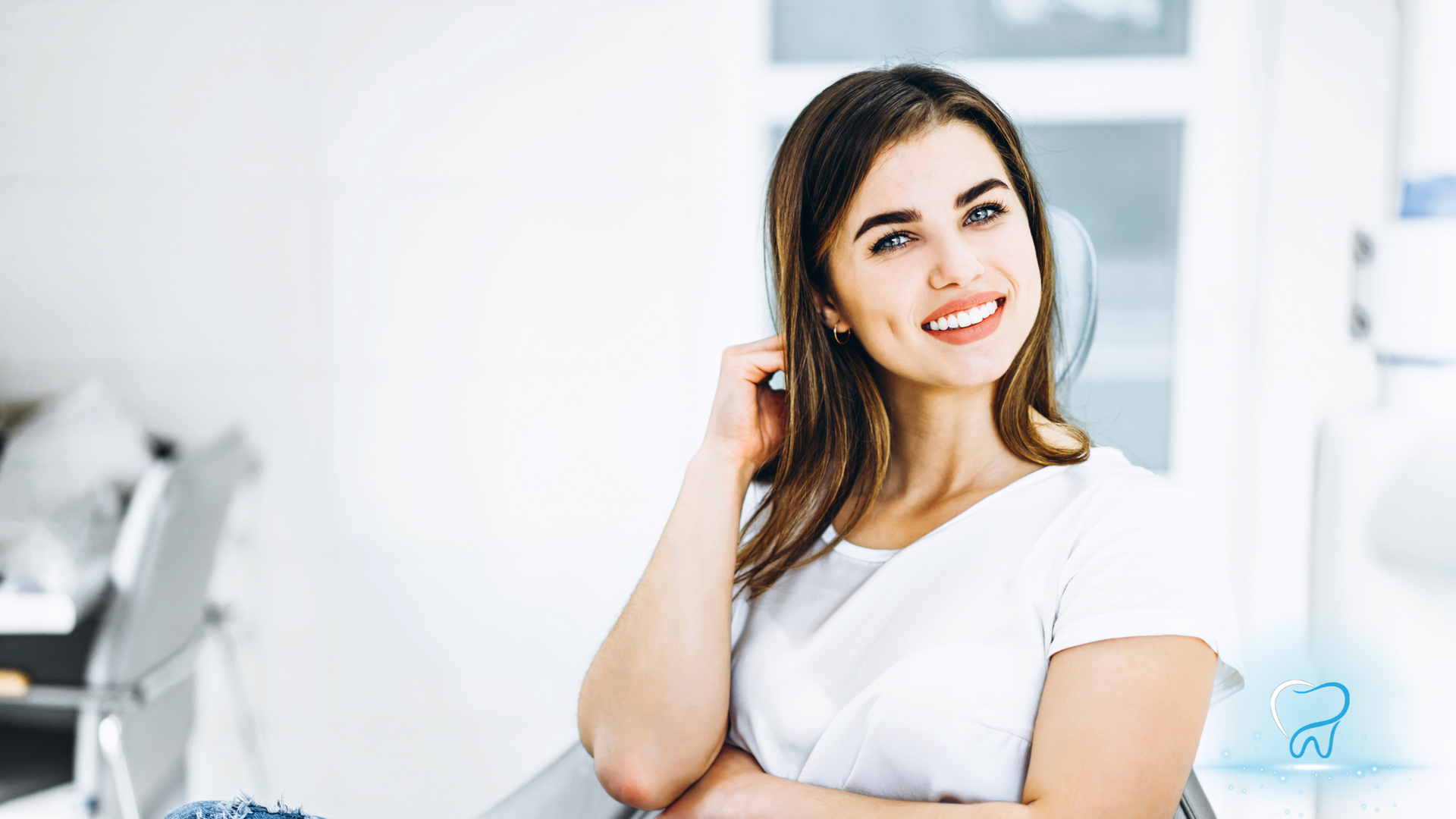 Smiling woman in a white top standing in a bright, modern office interior