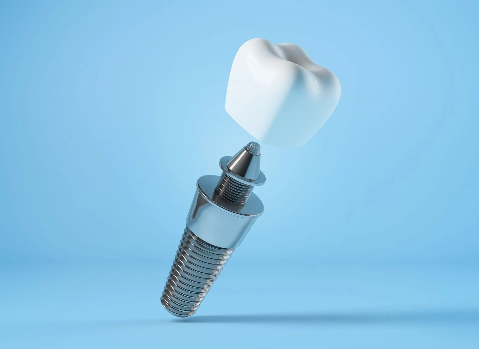 3D rendering of a dental implant with a white tooth floating above a blue background