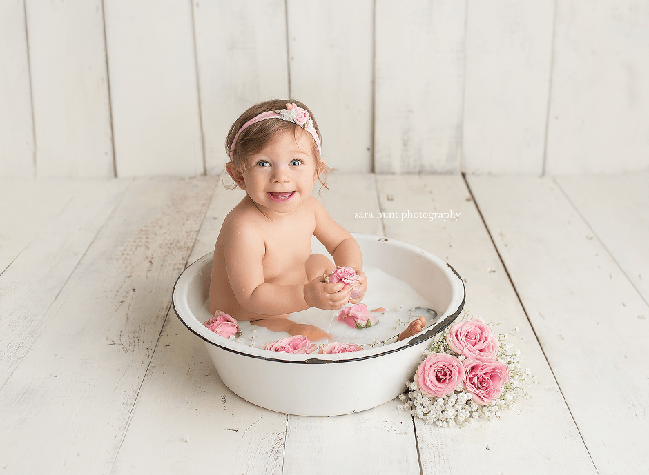 Baby smiling while on a basin — Pearland, TX — Sara Hunt Photography
