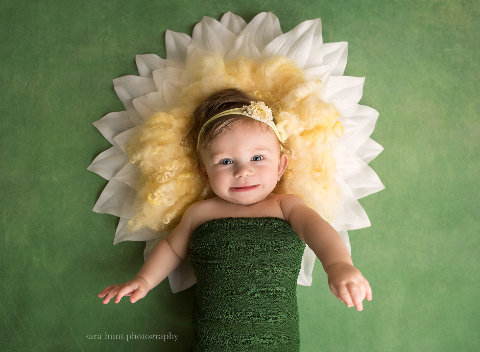 Baby with flower pillow — Pearland, TX — Sara Hunt Photography