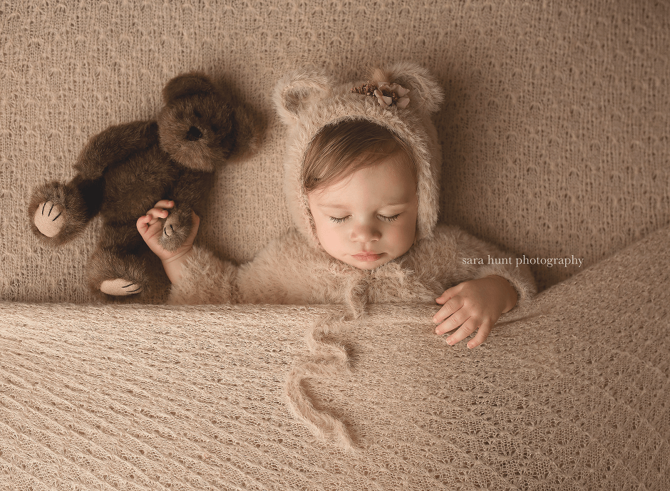 Baby sleeping while holding a teddy bear — Pearland, TX — Sara Hunt Photography