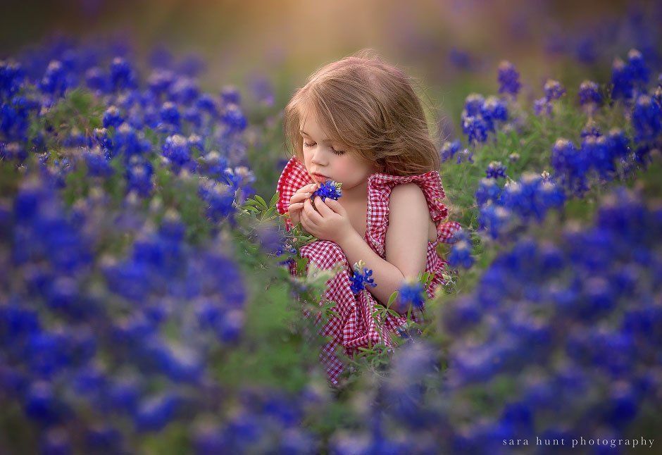 Girl holding bluebonnet — Pearland, TX — Sara Hunt Photography