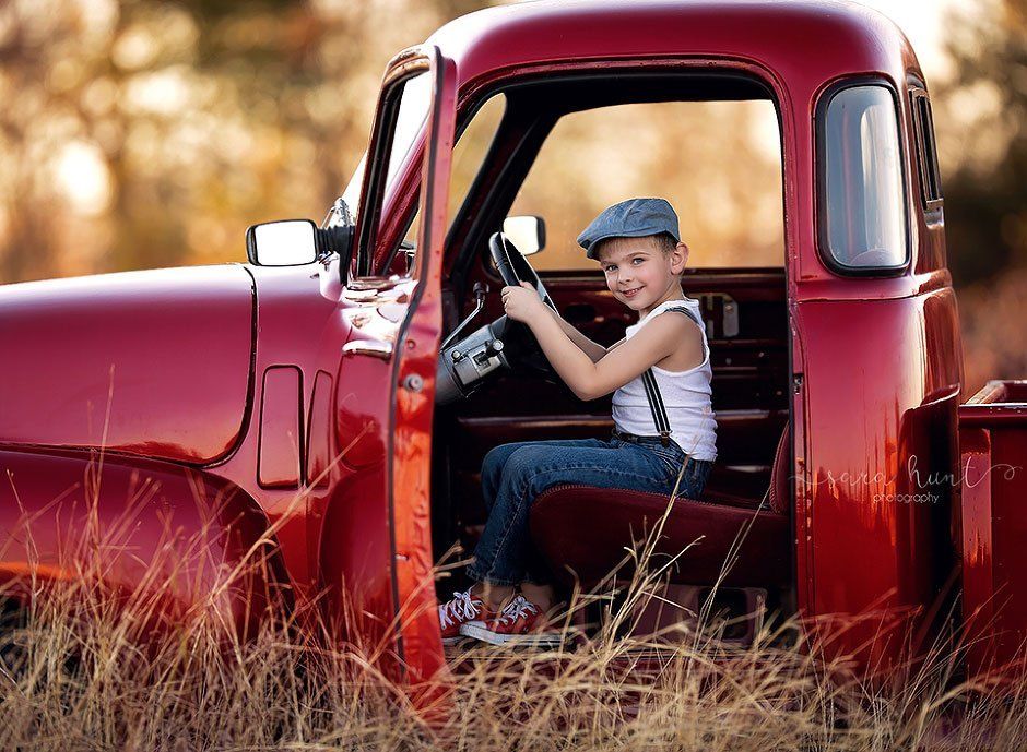 Boy holding on the steering wheel — Pearland, TX — Sara Hunt Photography