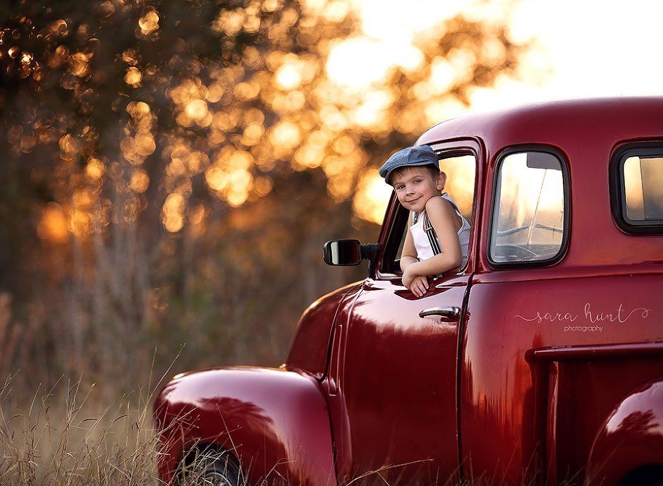 Boy in a red car — Pearland, TX — Sara Hunt Photography
